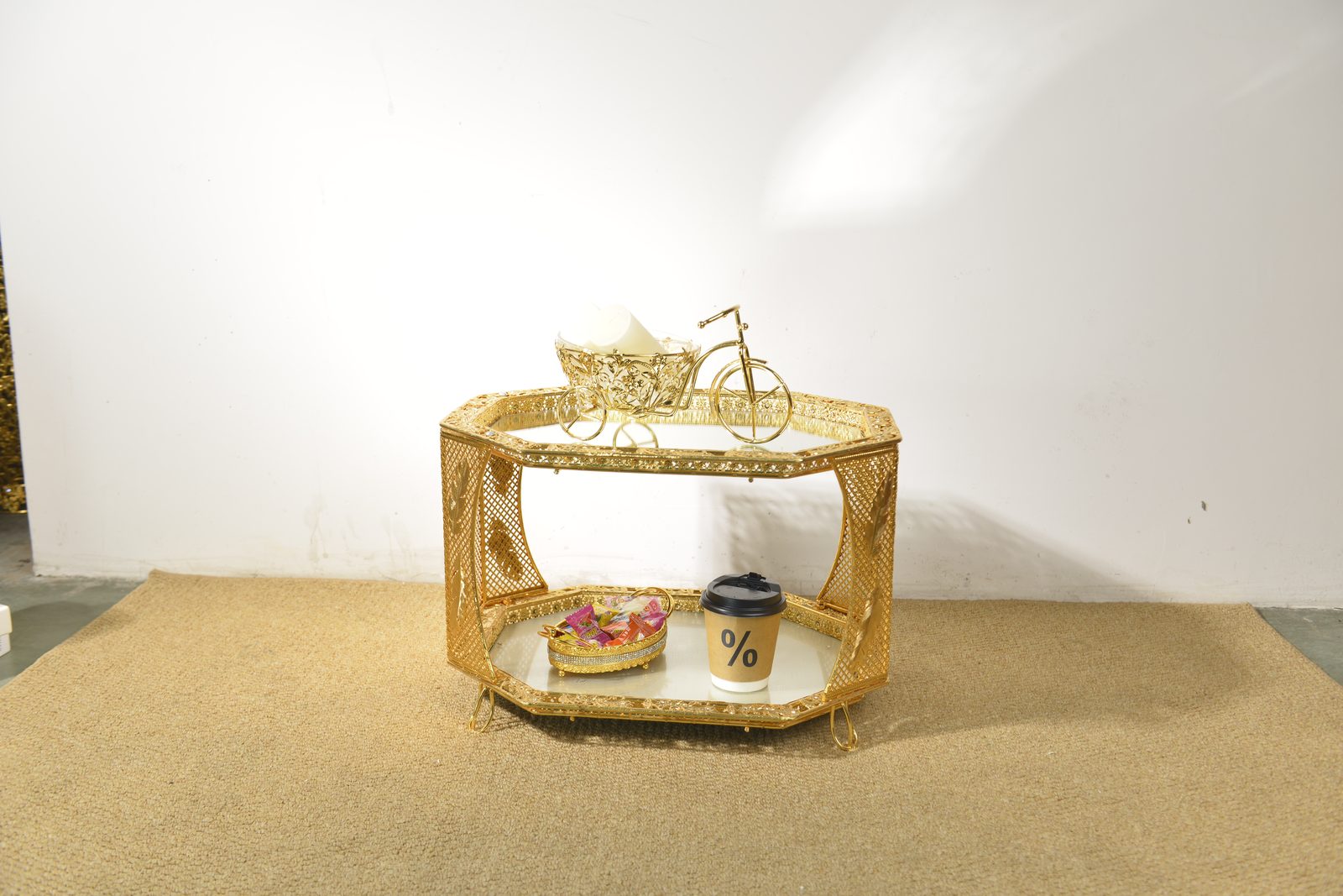 Octagonal two-tier gold metal coffee table with mirrored shelves