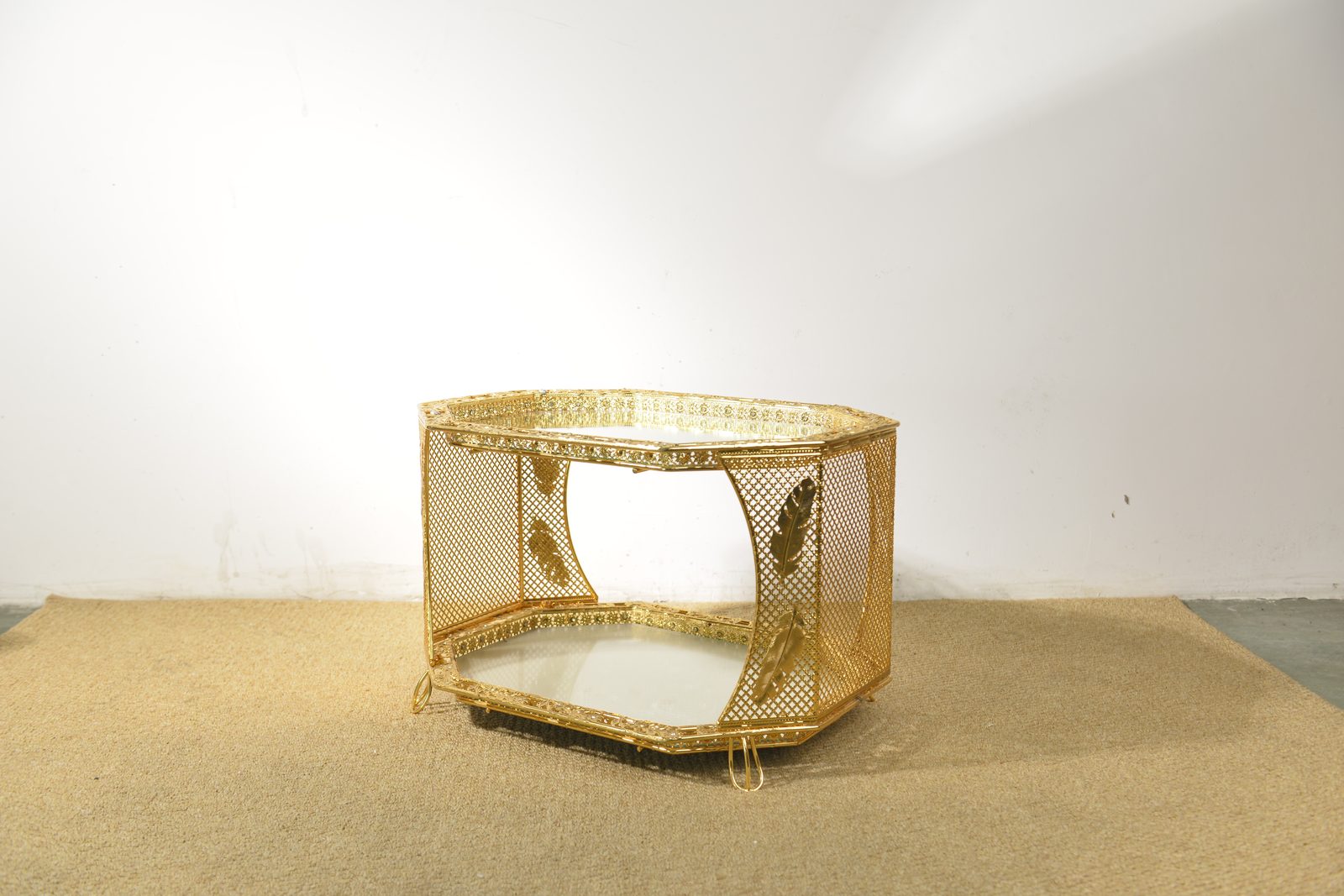 Two-tier gold metal side table with pierced lattice panels