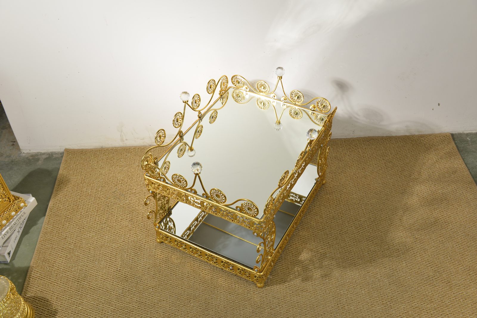 Ornate gold metal planter table with floral filigree metalwork